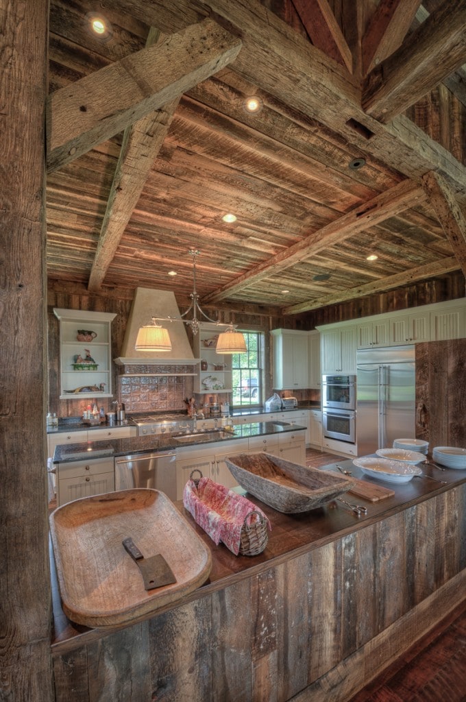 Reclaimed wood beams and barn boards in a party barn kitchen