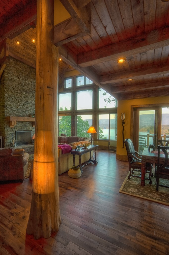 rustic lake house living room with timber framed round log cypress post